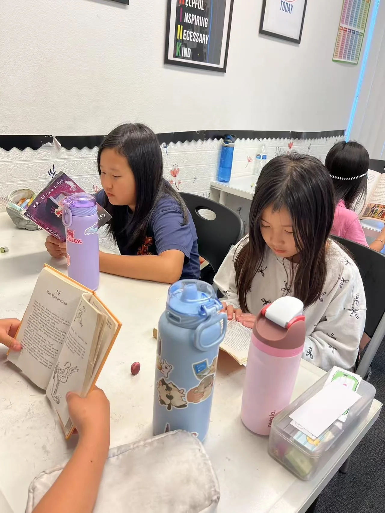 Girls reading in workshop